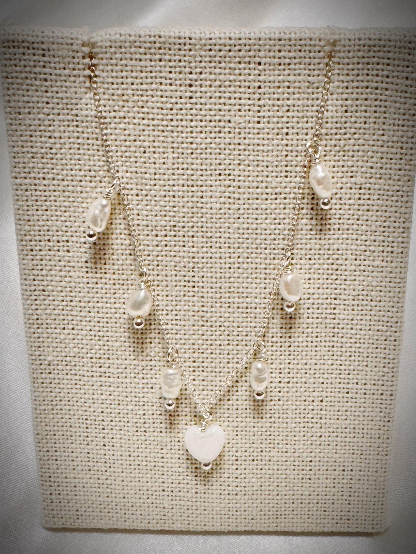 White freshwater pearls dangle necklace with white mother of pearl heart on silver chain 18”