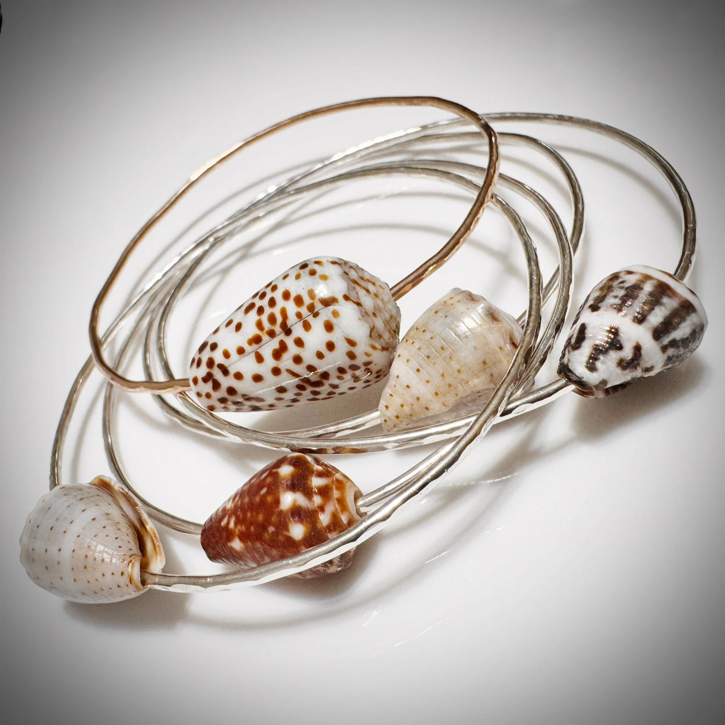 Blackish brown with white Cone seashell floating bangle