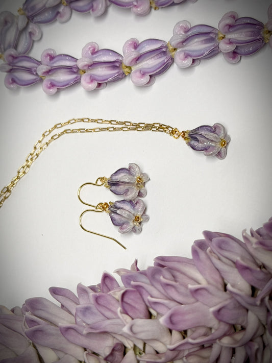 Pua Kalaunu purple dangle necklace on gold chain and earring set