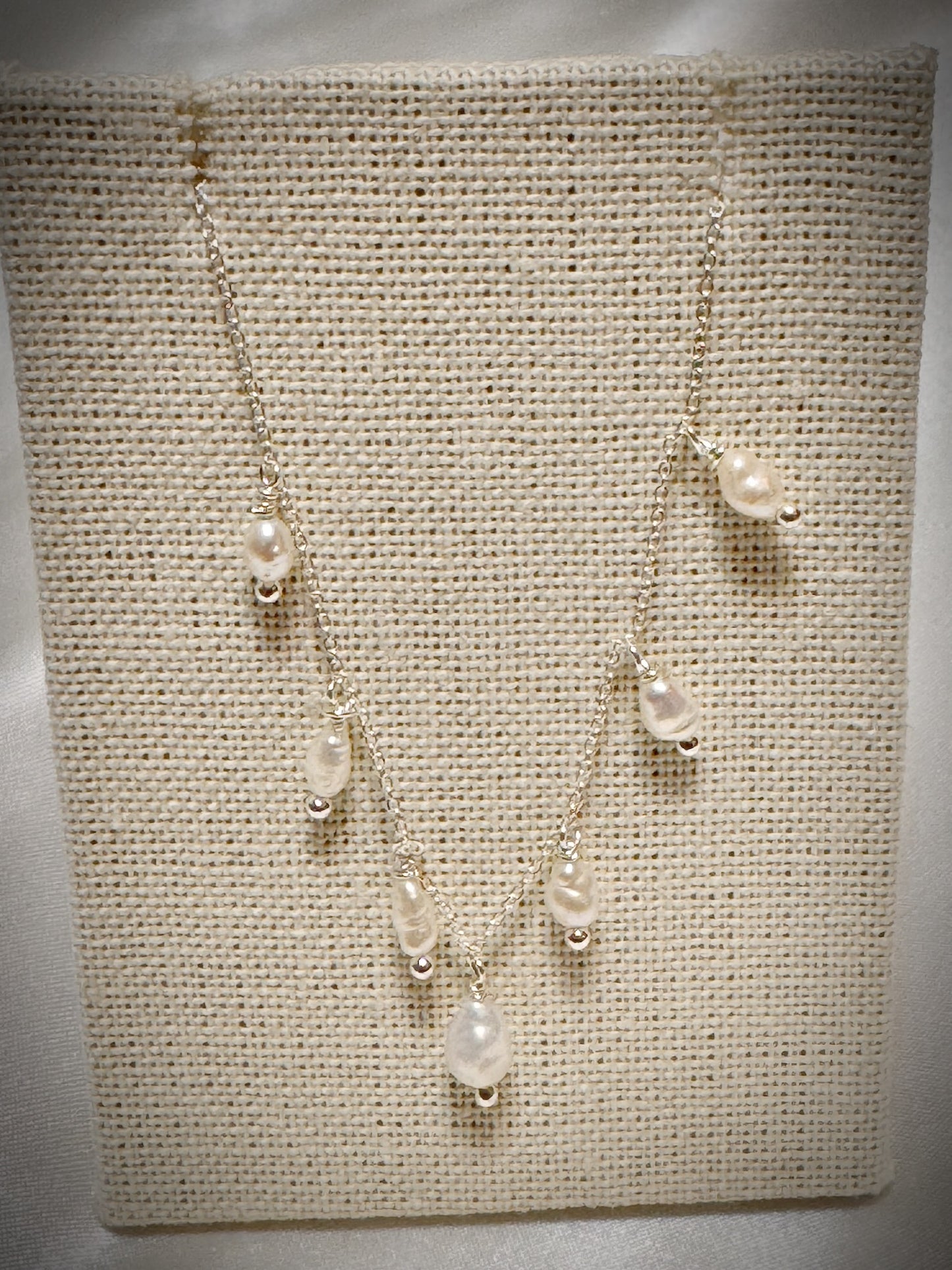 White freshwater pearls dangle necklace on silver chain 18”