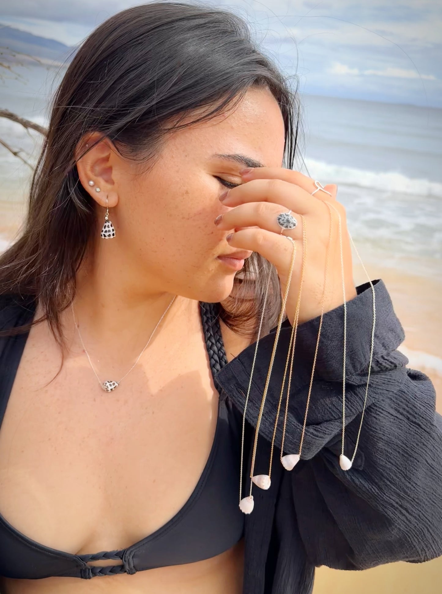 Brown with white calf Cone seashell floating necklace