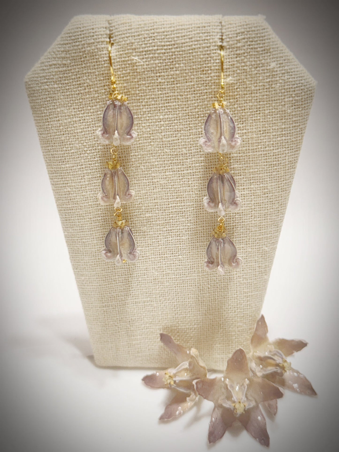 Pua Kalaunu purple triple dangle gold earrings