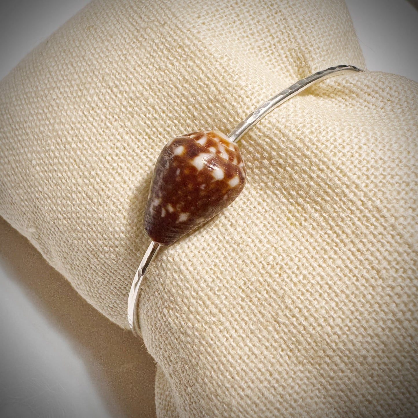 Brown with white calf Cone seashell floating bangle