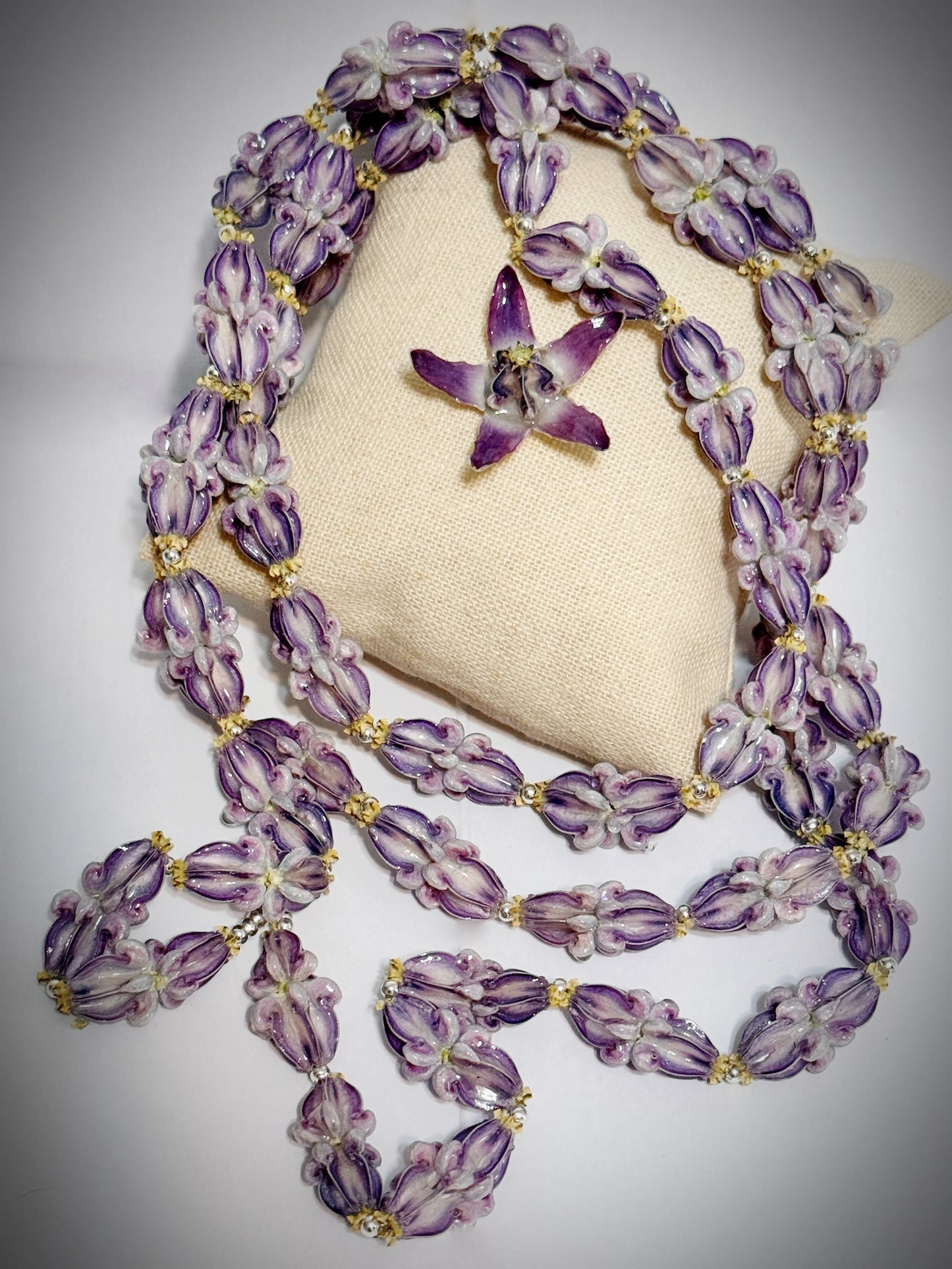 Pua Kalaunu purple extra long double dangle lei with silver spacers and clasp