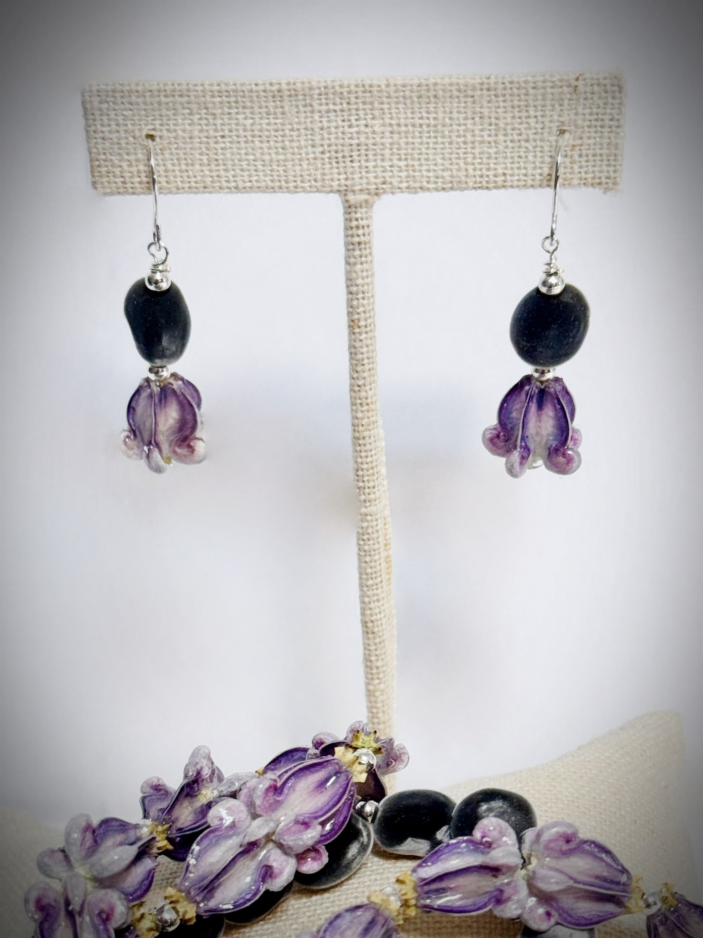 Maui mink seed & pua kalaunu (crown flower) silver dangle earrings