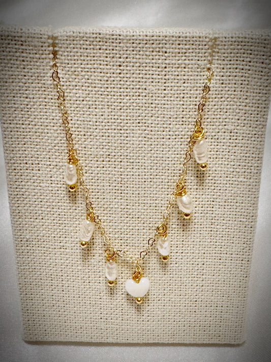 White freshwater pearls dangle necklace with white mother of pearl heart on gold chain 18”