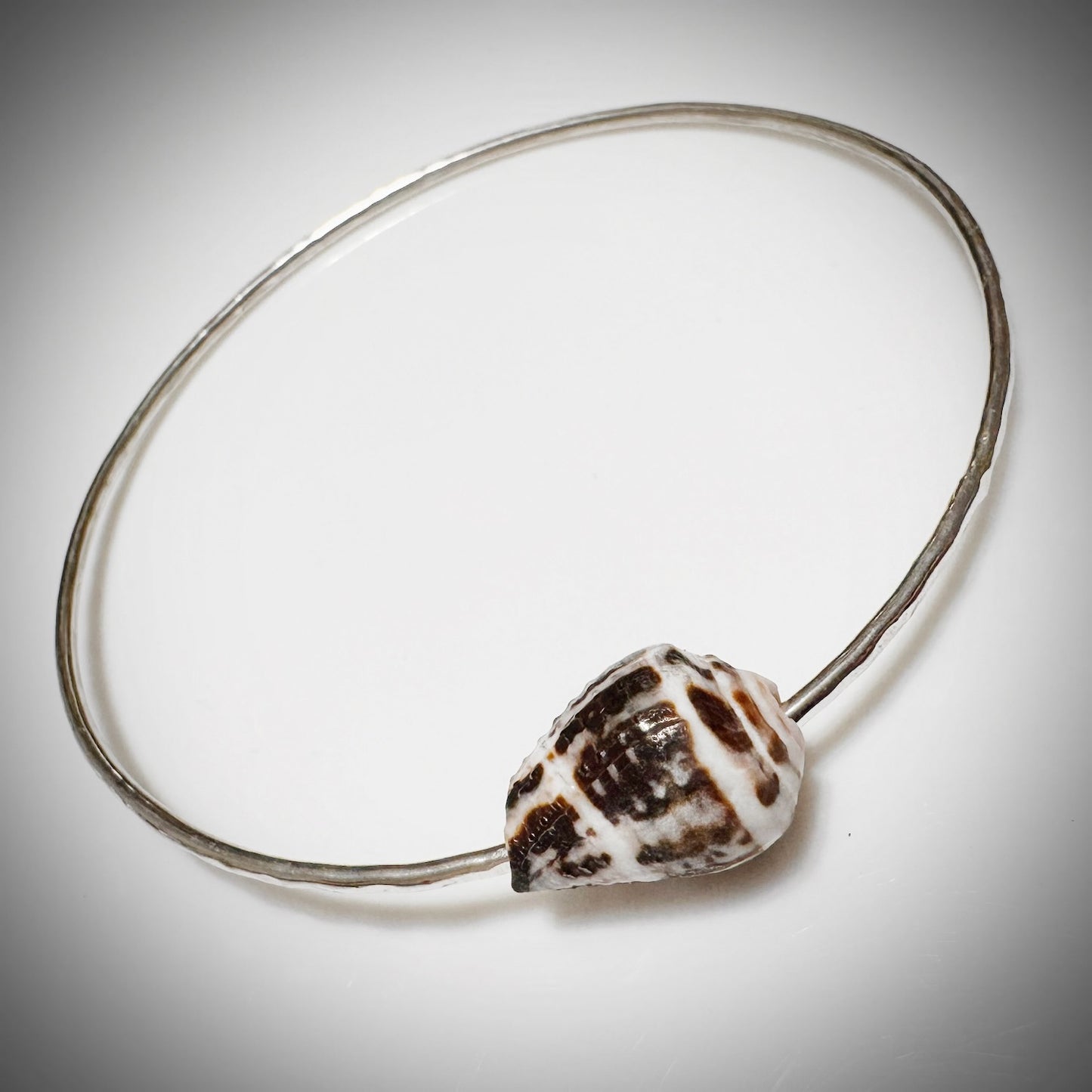 Blackish brown with white Cone seashell floating bangle