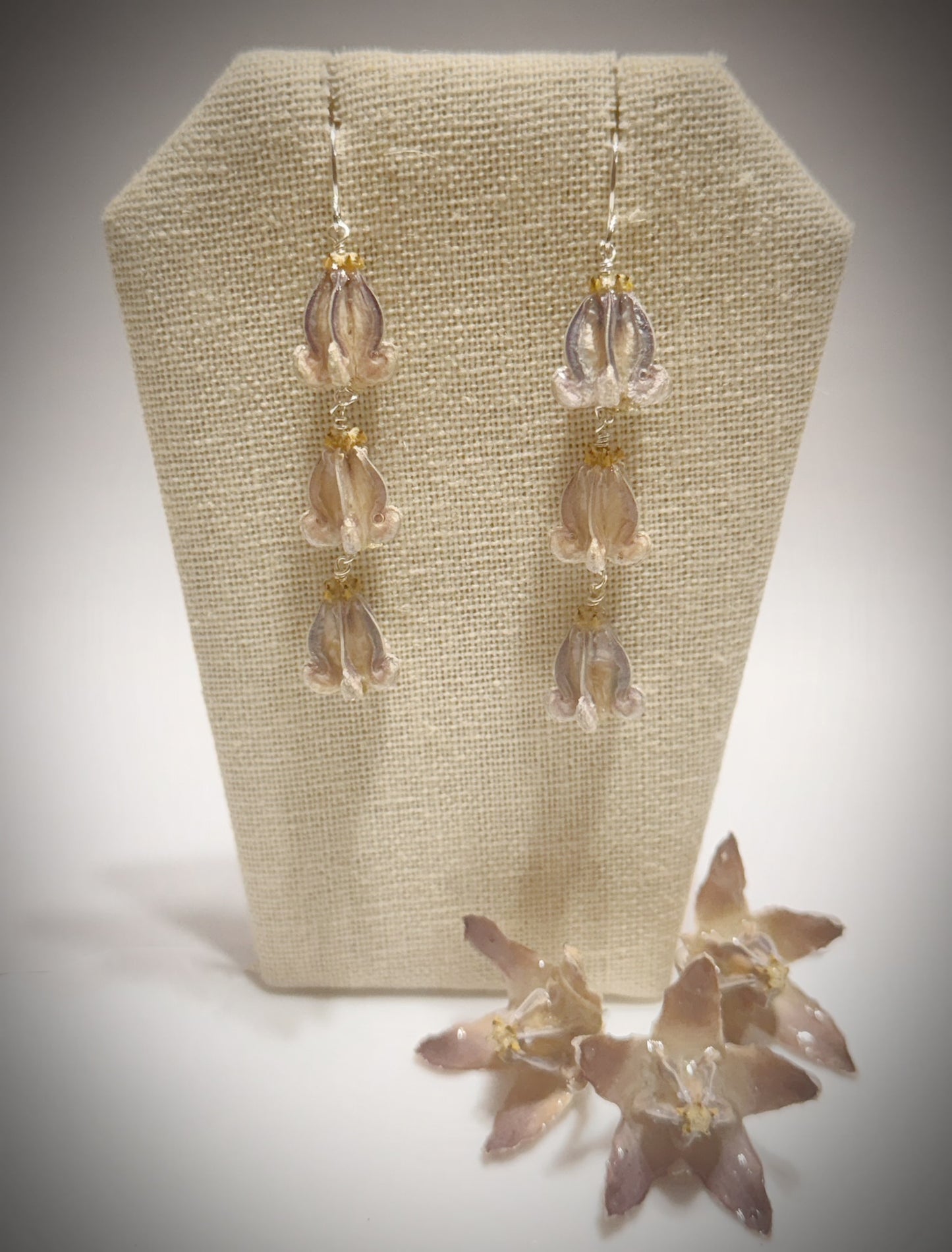 Pua Kalaunu purple triple dangle silver earrings