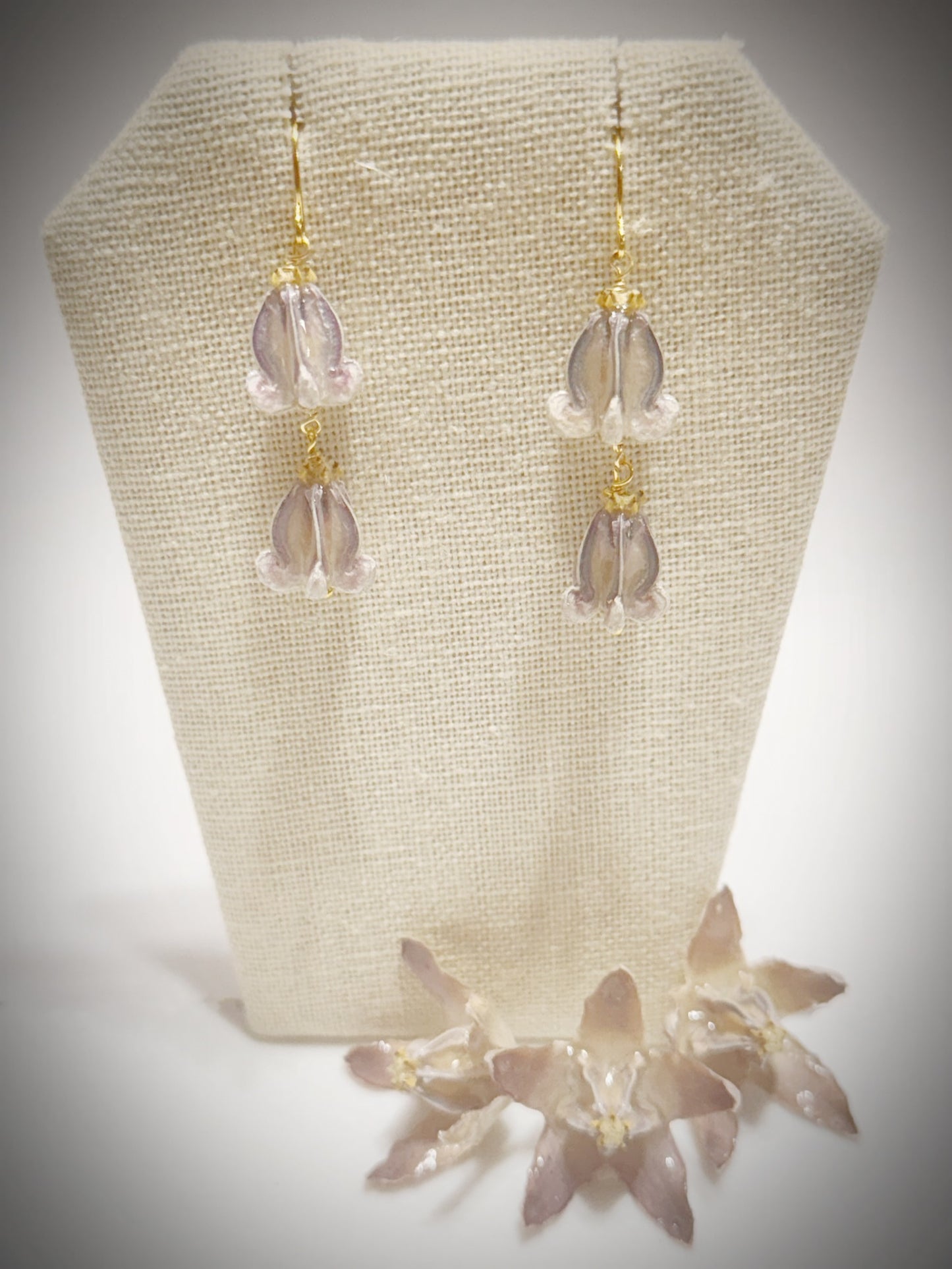 Pua Kalaunu purple double dangle gold earrings